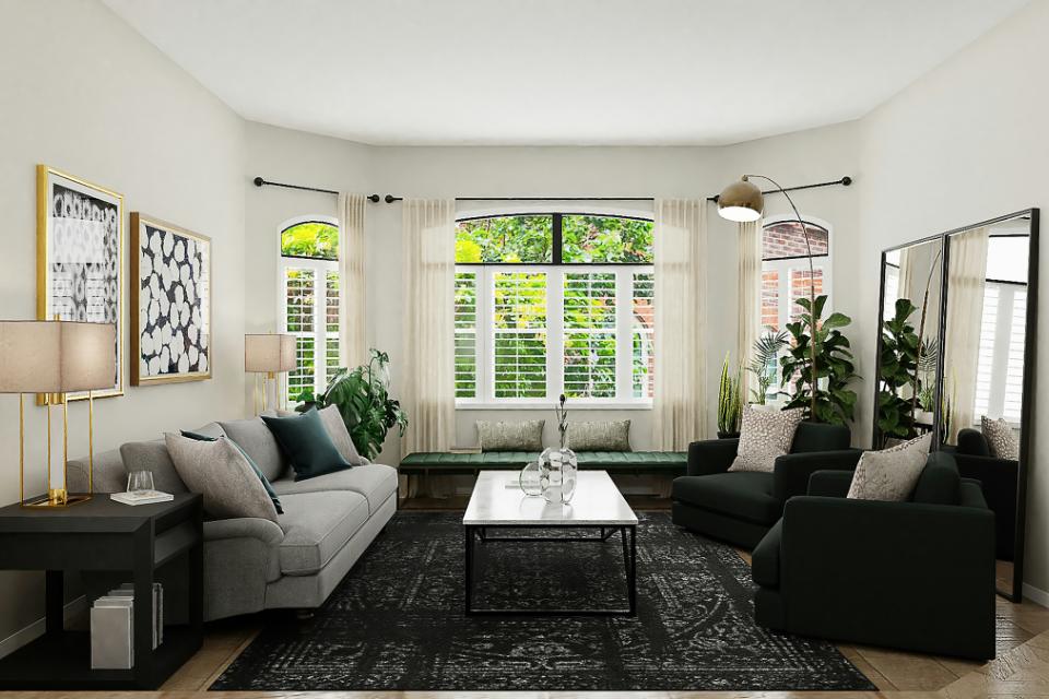 wood flooring in living room with black and grey monochromatic decor and furniture.